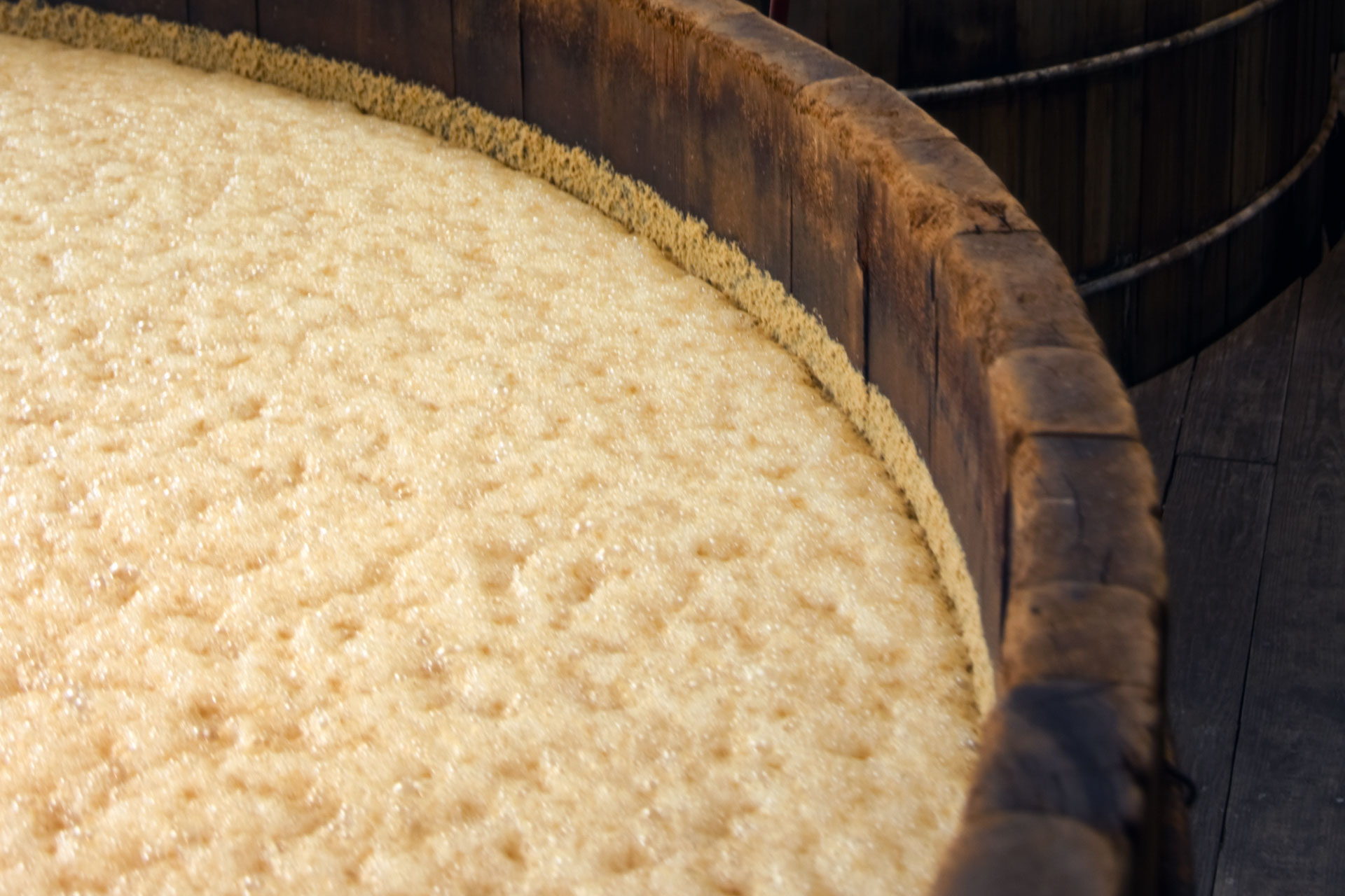 wooden barrel of bubbly liquid