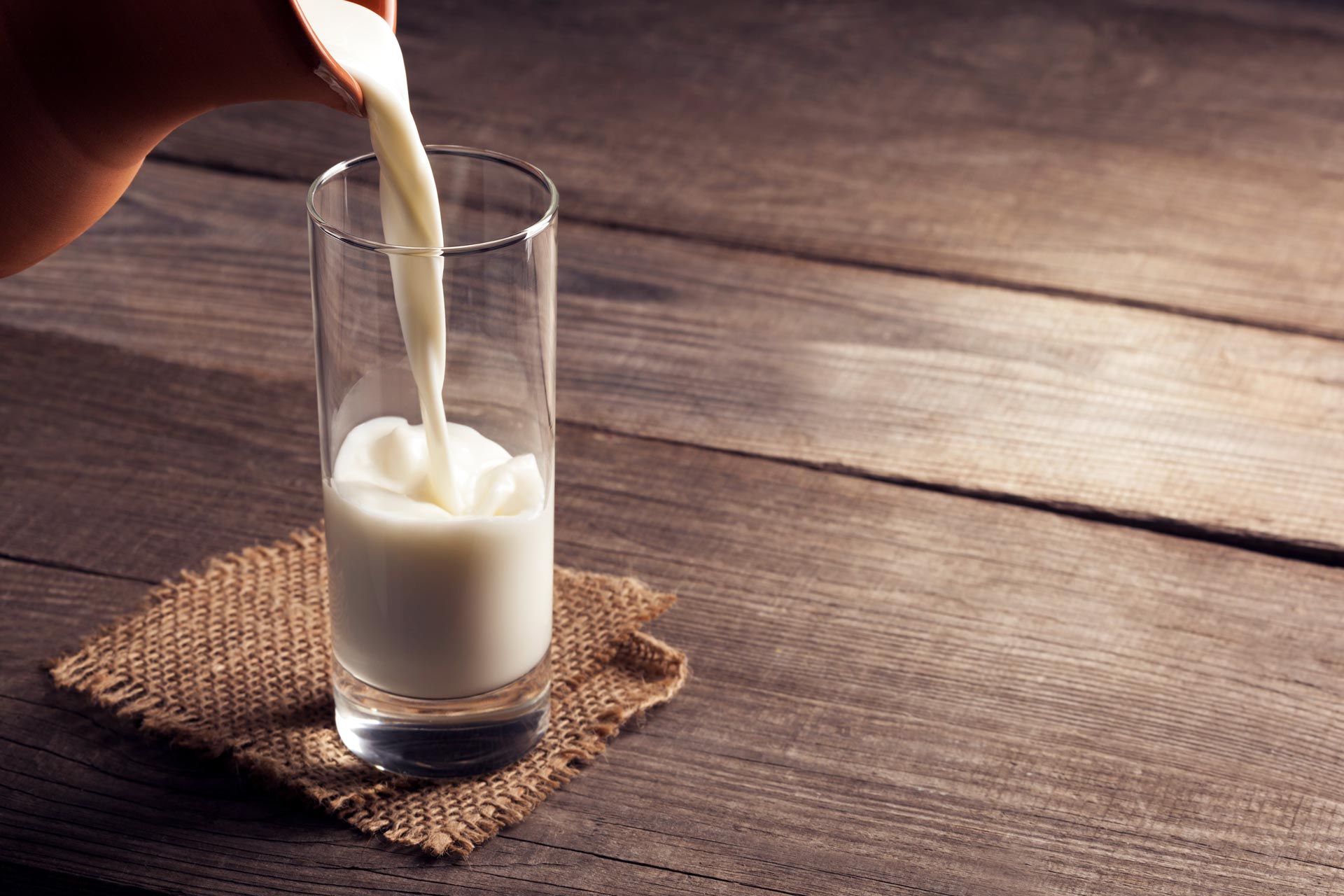 pouring a glass of milk