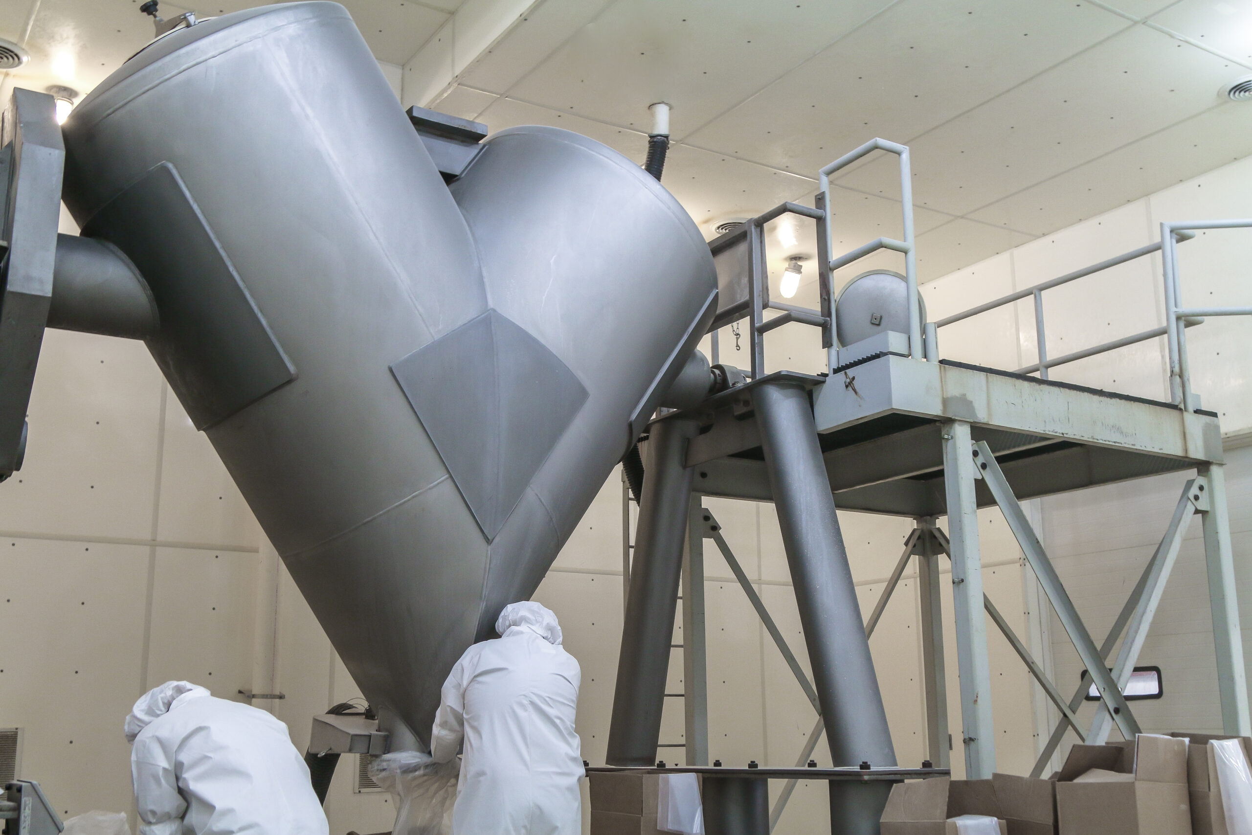 Technicians working with an industrial blender